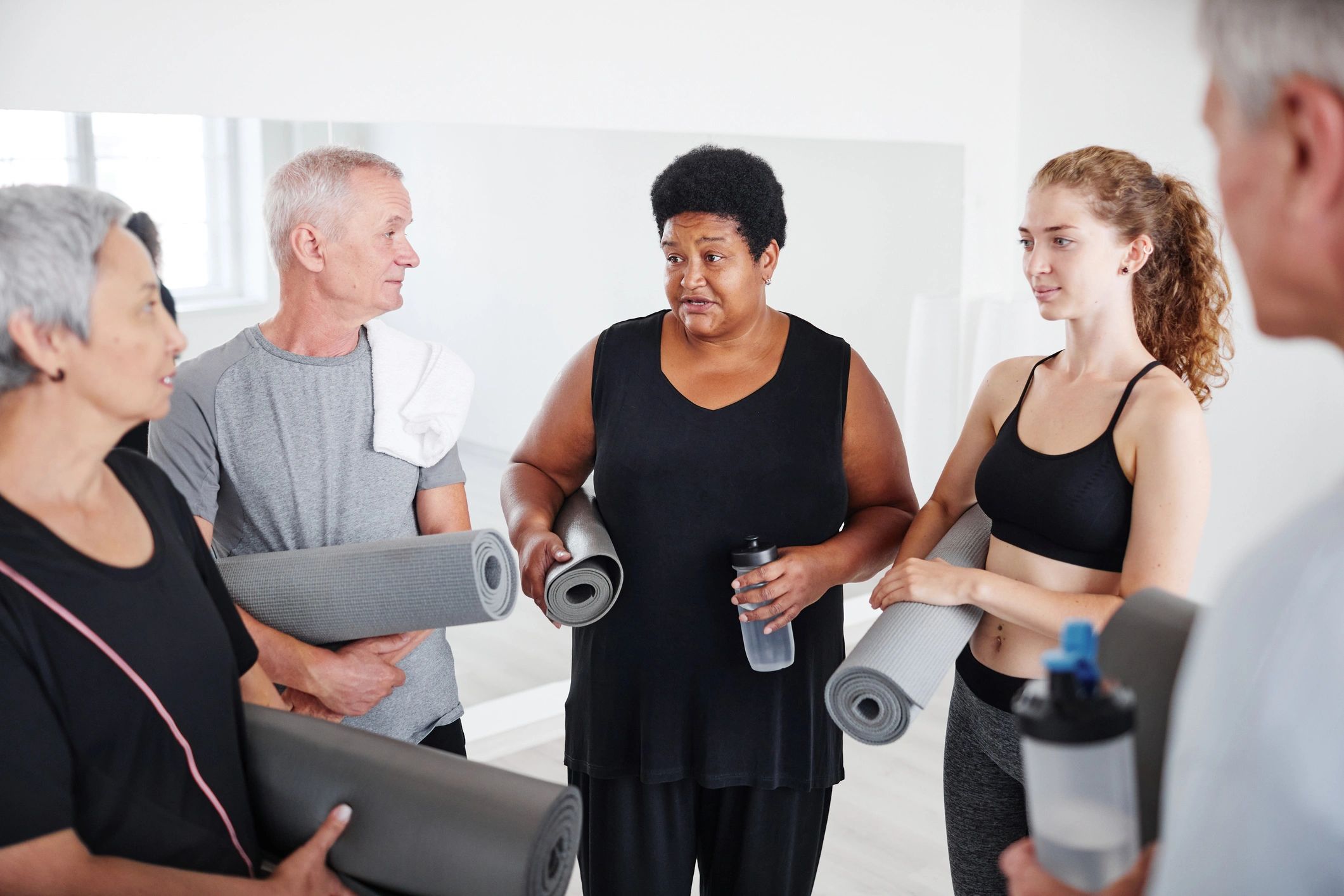 Group of seniors people with mats and water